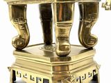 a gold statue of an elephant on a pedestal