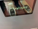 a close up of a person standing in front of a microwave