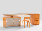 an image of a desk with a chair and a desk top