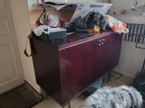 a dog that is standing next to a table