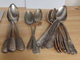 a lot of spoons and spoon spoons sitting on a table