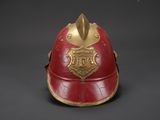 an old fireman ' s helmet on a black background