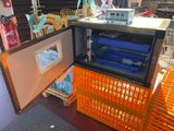 a small refrigerator that is inside of a store