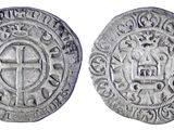 une pièce d'argent avec une croix au recto et une croix au verso