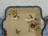 a lot of plates that are sitting on a table