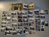 a lot of old black and white photos on the wall