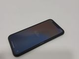 a close up of a cell phone sitting on a table