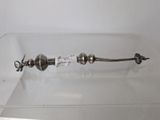 a silver object on display in a glass case