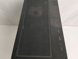 a close up of a black computer case on a white surface