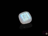 a close up of a white stone with a black background
