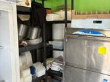 a small kitchen with a lot of items on the shelves