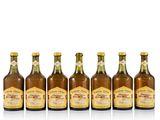 six bottles of beer lined up in a row on a white surface