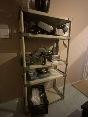 a shelf with many items on it in a room