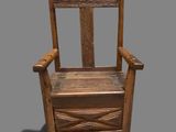 a wooden chair with a seat made of wood on a gray background