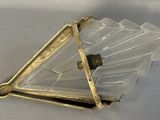an image of a triangle shaped glass light fixture on a white surface