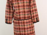 a red and black plaid coat on a mannequin mannequin mannequin mannequin mannequin mannequin mannequin mannequin