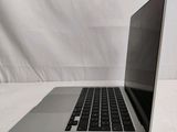 an open laptop computer sitting on top of a white table