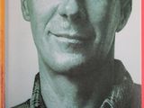 a book with a picture of a man in a plaid shirt