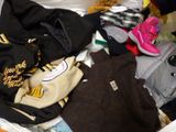 a pile of clothes that is sitting in a box