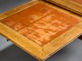 a table with a drawer underneath it on a gray surface