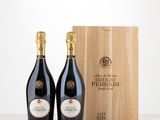 two bottles of wine in front of a wooden box
