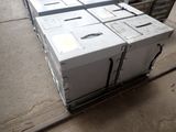 many boxes that are sitting on a cart