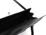 the large black purse is open and ready to be carried