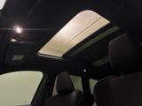 a view of the sunroof from inside of a car