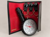 an image of a leather case with a pocket watch and keychain