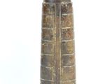 a brown vase that is sitting on a white surface