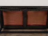 an image of a wooden bench with two red cushions on it