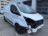 an image of a damaged van in a parking lot