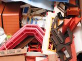 a pile of assorted construction materials in a box