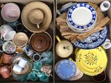 une boîte remplie de plats et de bols de toutes sortes