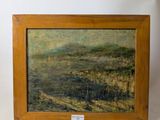 an oil painting of a landscape in a wooden frame on a white surface