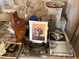 a picture of a vase and other items on a table