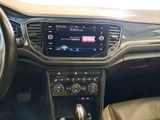the interior of a car with a steering wheel and dashboard controls