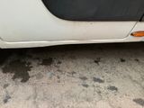 a white car that is parked in a lot