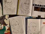 several pages of comics are spread out on a table