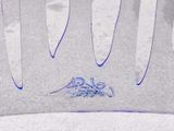 a close up of a plastic chair with a blue design on it