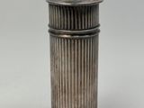 an antique silverplated canister with a domed lid