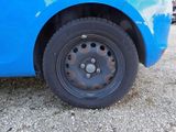 a close up of a tire on a blue car