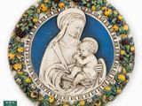 an image of a statue of a woman holding a baby