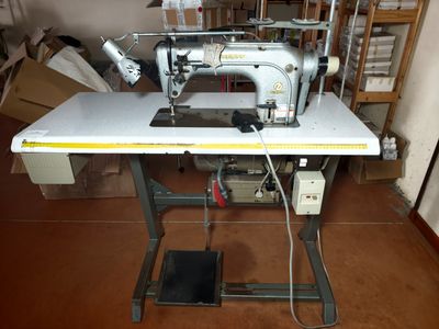 a sewing machine sitting on a table in a room