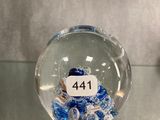 a glass ornament with a snowman inside of it