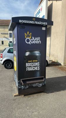 a black box with a crown on it sitting in a parking lot