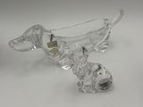 pair of clear glass dachshund figurines on a white surface