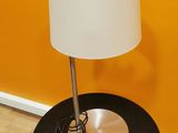 a black table with a white lamp on top of it