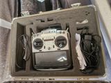 a case with a radio and other electronics inside of it
