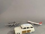 a toy car and a toy plane on a table